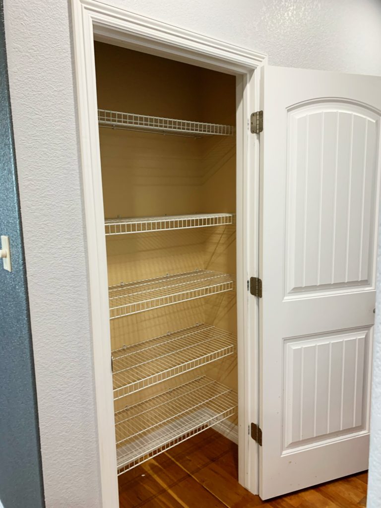 Empty Yellow Wire Shelving Pantry 